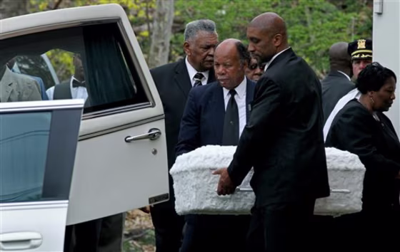 The casket of one of three children is placed in a hearse in Spring Valley, N.Y.,&nbsp;on April 25,&nbsp;as the service ends for the children who were driven into the Hudson River in a van by their mother LaShanda Armstrong, who also died.&nbsp;A fourth child survived. 